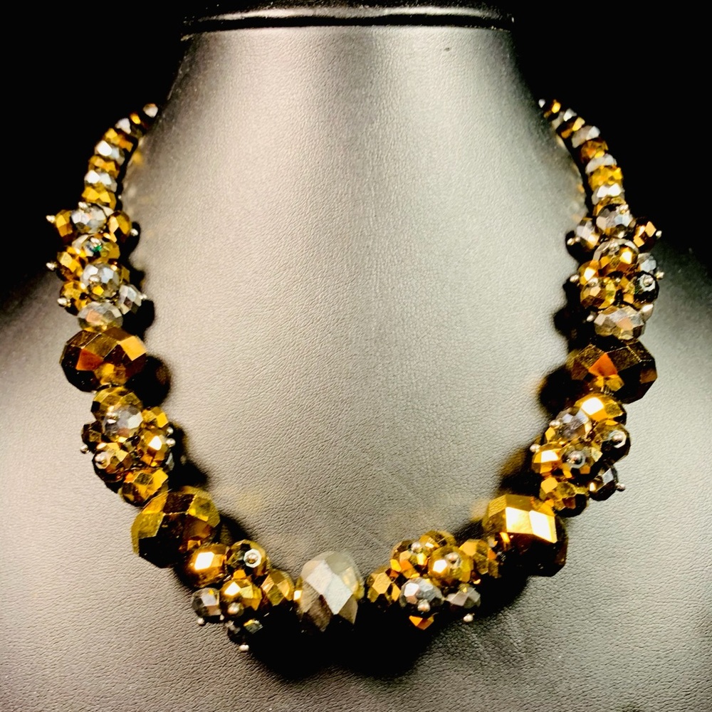 Chunky silver and gold tone statement necklace.
